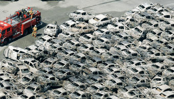 Damaged cars were swept together at the port of Hitachi in Ibaraki Prefecture. PHOTO: KYODO NEWS/XINHUA/POLARIS